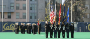 Midshipmen on field performing flag color guard activities