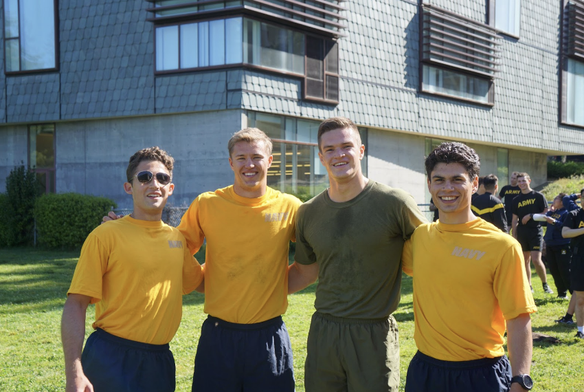 Group of four midshipmen at North Field wearing physical training attire