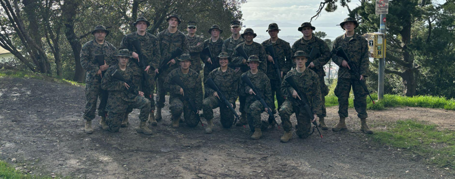 Midshipmen outside in camouflage uniforms during a field exercise