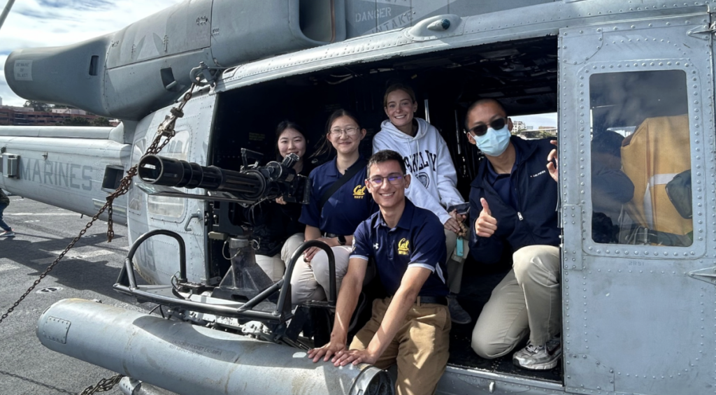 Group of five midshipmen inside a United States Marines military helicopter